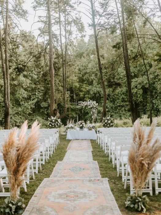 Backyard Wedding Decoration for ceremony Aisle with vintage rugs