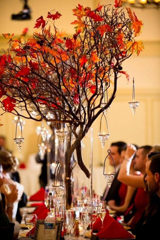 Fall wedding decor with red maple branches